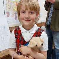 girl holding teddy